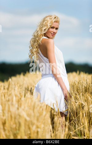 Young woman in wheat field Stock Photo - Alamy