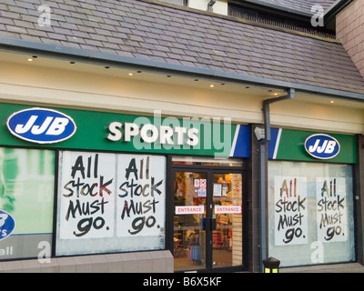 UK JJB Sports store shop window with all stock must go signs Stock Photo