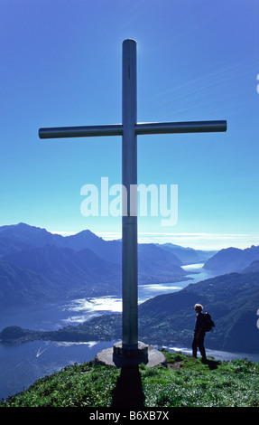 Cross on Monte Crocione near Monte Tremezzo, Lombardy, Italy. View over Lake Como and Bellagio. Stock Photo