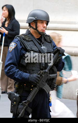 New York City Police Department Emergency Service Unit officer on Wall Street in New York City New York USA Stock Photo