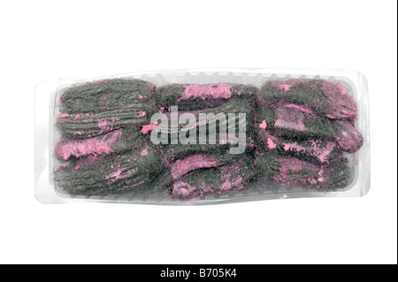 Soap filled wire wool pan scourers in a clear plastic container Stock Photo