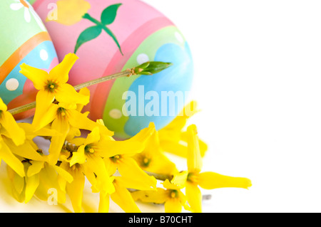 Easter eggs arrangement with spring flowers isolated on white background Stock Photo