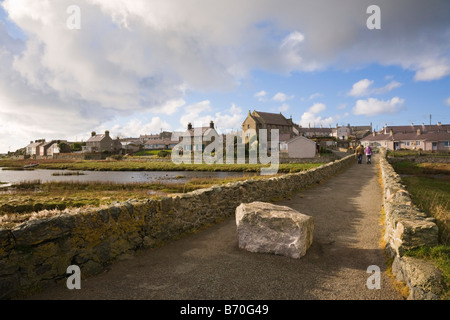 Old stone bridge to village across Afon Ffraw River in Aberffraw Isle of Anglesey North Wales UK Stock Photo