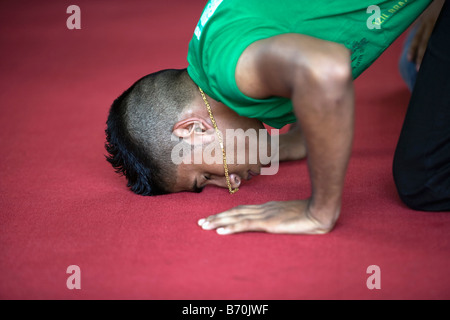 Suriname, Paramaribo, Friday prayers at main mosque in Keizerstraat  in the historic inner city. Portrait. Stock Photo