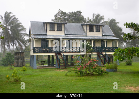 Suriname, Paramaribo, Restored plantation called Frederiksdorp at the Commewijne river. Now hotel. Rain. Stock Photo