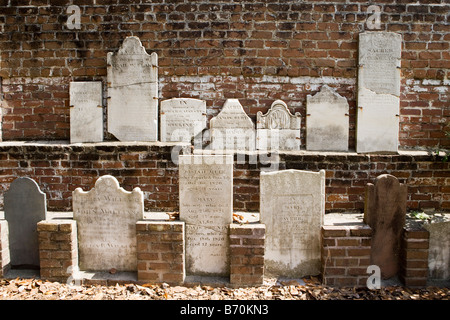 A collection of 19th century headstones along the east wall at Colonial Park Cemetery in Savannah, Georgia. Stock Photo