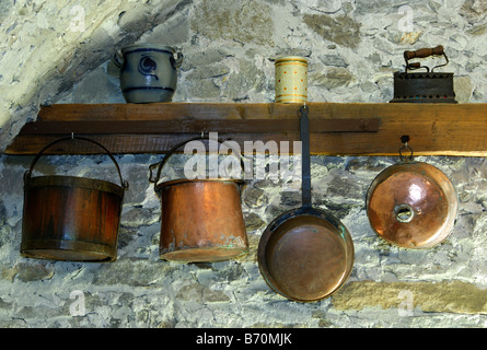 Copper kettles, copper pans and other crockery in a farmhouse in Ticino, Switzerland Stock Photo
