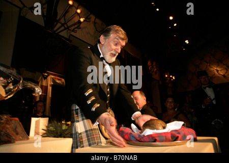 Addressing the haggis at a traditional Burns Night Supper Stock Photo