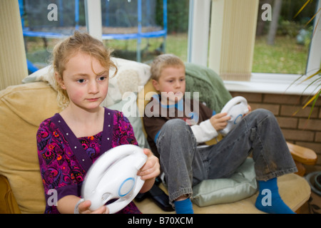A family playing computer games on a Wii console Stock Photo
