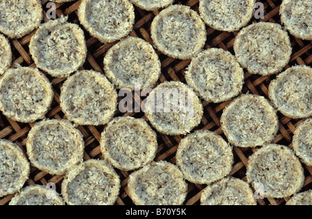 Rice Cakes or Biscuits Drying on Bamboo Rack, Luang Prabang, Laos Stock Photo
