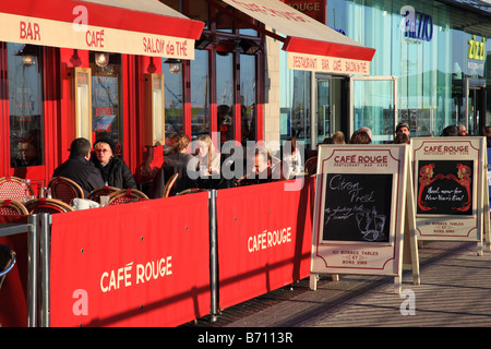 People eating in winter outside the Cafe Rouge in Brighton Marina England Stock Photo