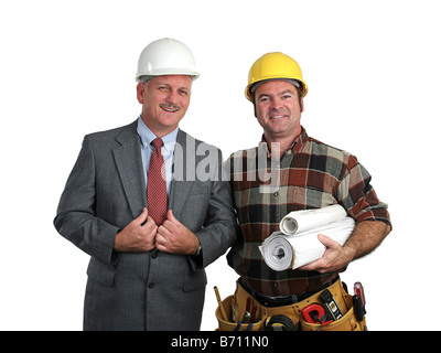 an engineer and a contractor posing together with blueprints Stock Photo