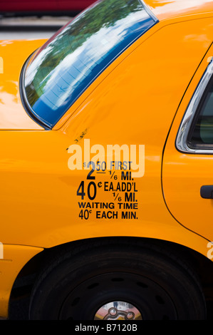 Miami South Beach , Ocean Drive , detail side aspect of super yellow taxi cab car , fare tariff Stock Photo