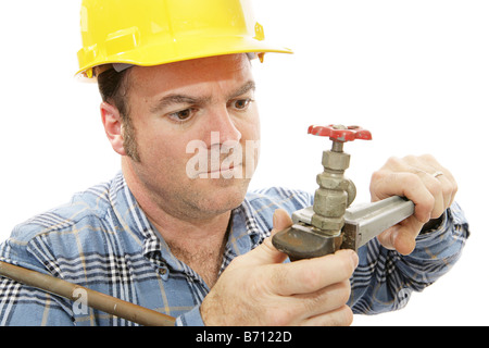 Closeup view of a construction plumber working on a faucet Stock Photo