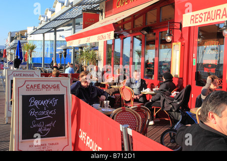 People in winter outside the Cafe Rouge in Brighton Marina England Stock Photo