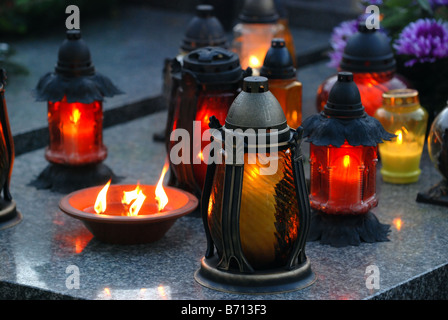 Candles on Wolski cemetery in Warsaw, Poland during All Saints Day Stock Photo