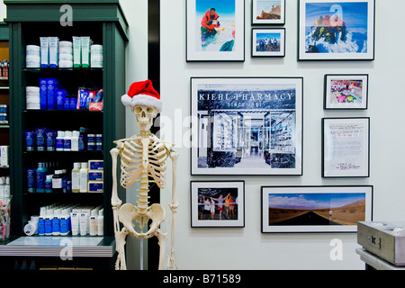 Florida West Palm Beach Gardens Shopping Mall center Xmas decoration at Kiehl Pharmacy skeleton with Father Christmas hat in department store Stock Photo