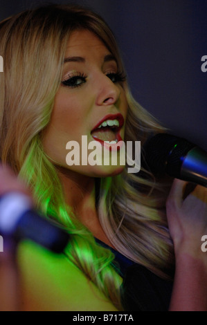 Mollie King of the pop group 'The Saturdays' performing on stage. Stock Photo