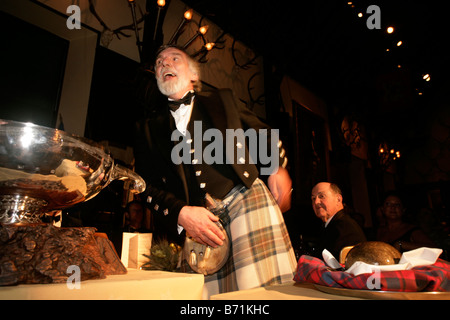 Addressing the haggis at a traditional Burns Night Supper Stock Photo