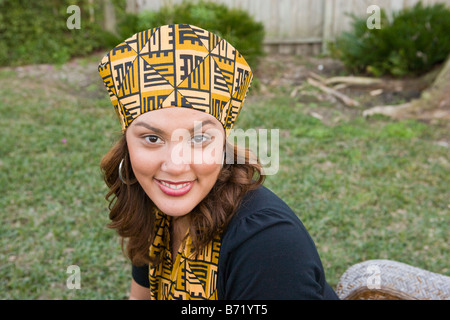 Happy African American mid-adult woman dressed in traditional attire Stock Photo