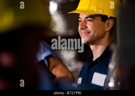 Closeup of co-workers in storage warehouse Stock Photo