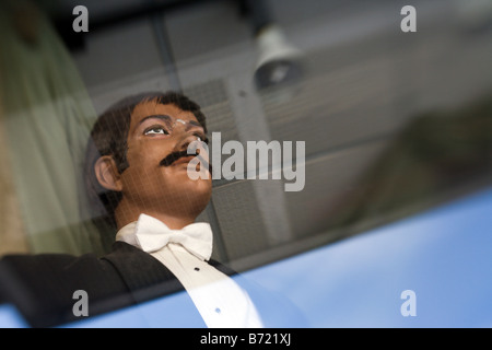 Creepy male mannequin in a shop window Stock Photo