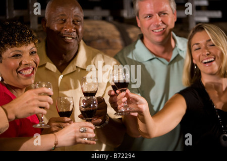 Two couples toasting red wine Stock Photo