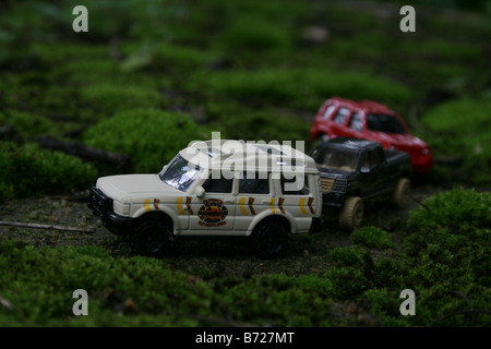 Toy car jeep suv safari Tourists in SUV and pick-up cabs touring the lush green tea estates during their annual holiday vacation away from home Stock Photo