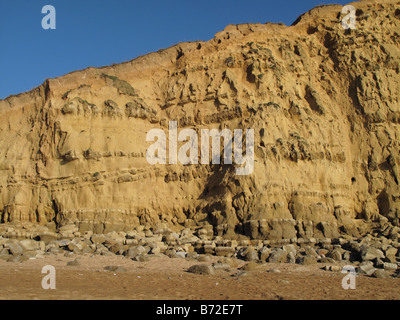 Beach and sandstone of East Cliff at West Bay near Bridport on the Jurassic Coast of Dorset Stock Photo