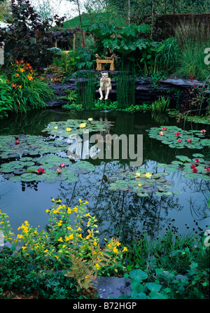 Water Lily pool with spouting figure Stock Photo