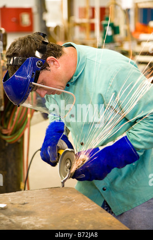 Machinist working in a metal factory Authentic and accurate Stock Photo