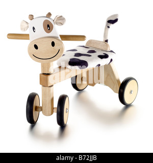 cow trike wooden child play toy infant pre school Stock Photo