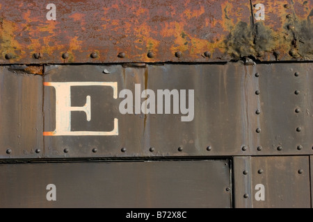 The letter E on the side of rusty old train car Stock Photo