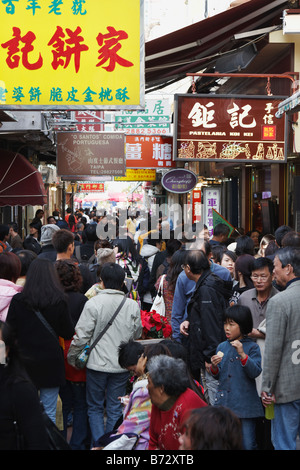 Chinese Tourists Walking Along Shopping Street In Taipa Village, Macau Stock Photo