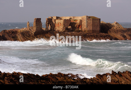 British Channel Islands. Alderney. Coastal ruin of Victorian Fort Les Hommeaux Florains. Stock Photo