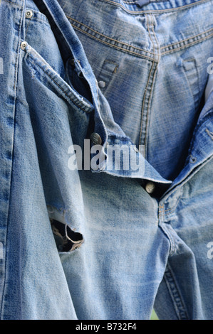 Worn Out Light Blue Jeans Denim Trousers On The Knee Stock Photo - Download  Image Now - iStock