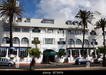 entrance of the winchester mansions hotel and harvey's bar along beach road sea point cape town south africa Stock Photo