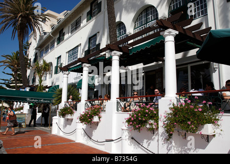 entrance of the winchester mansions hotel and harvey's bar along beach road sea point cape town south africa Stock Photo