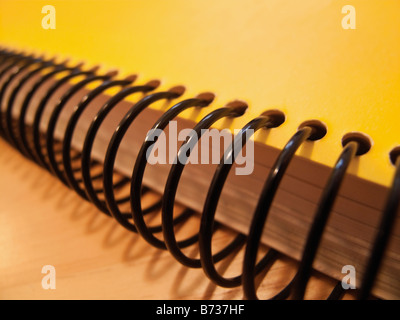 Back of yellow spiral notebook Stock Photo