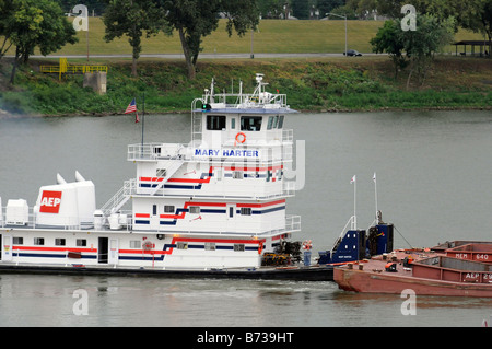 A barge moving cargo on the Ohio River near Cincinnati Ohio and Covington Kentucky. Stock Photo