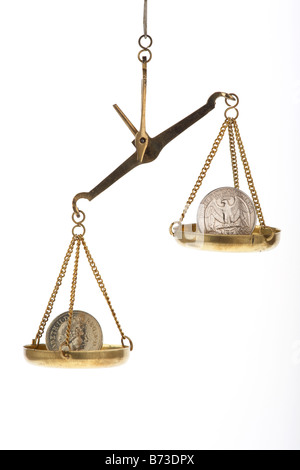 one us quarter dollar 25c coin and one pound coin on balancing scales quarter higher Stock Photo