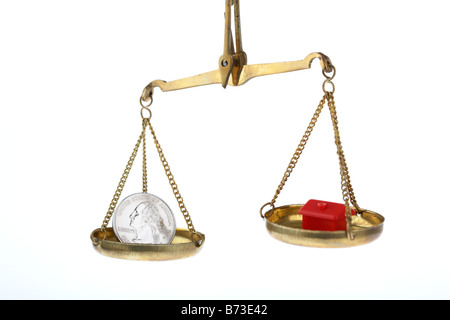 toy red house and one us quarter dollar 25c coin on balancing scales house higher concept us commercial property market and home loan rates Stock Photo
