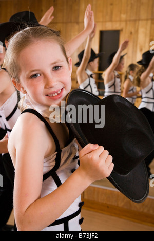 Girls performing dance routine in costume Stock Photo