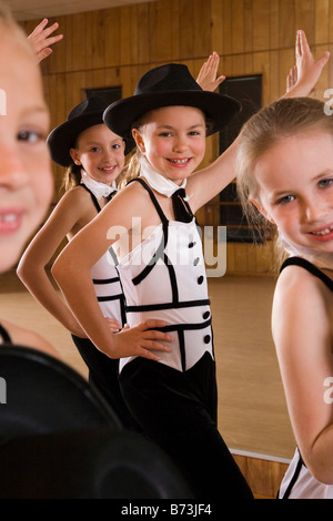 Girls performing dance routine in costume Stock Photo