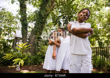 Happy African-American children playing in back yard Stock Photo
