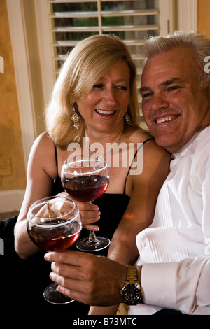 Close-up of romantic middle-aged couple drinking wine Stock Photo