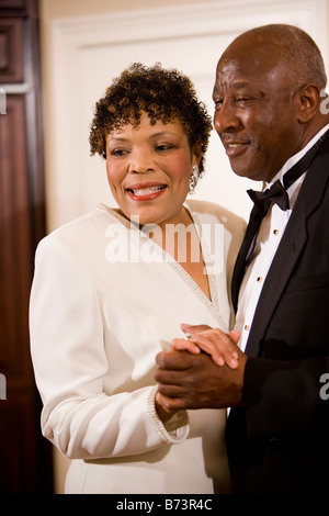 Senior african american couple dancing together in living room Stock ...