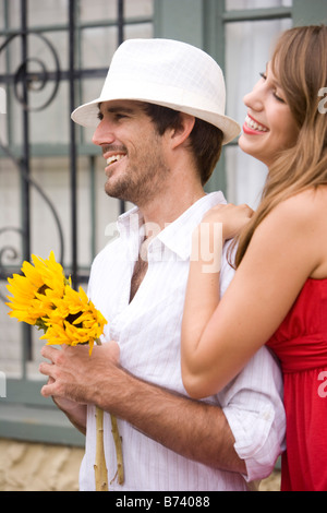 Young attractive couple standing together outside Stock Photo