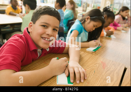 Hispanic school boy making name card Stock Photo