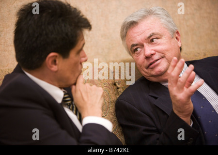 Two multi-racial businessmen having discussion in office Stock Photo